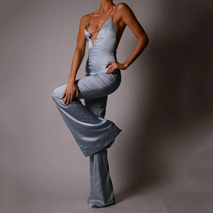 Light blue satin halter neck jumpsuit with deep V-neck and metal chain straps