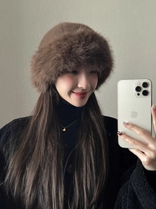 Close-up of soft brown faux fur texture and warm plush material on winter bucket hat
