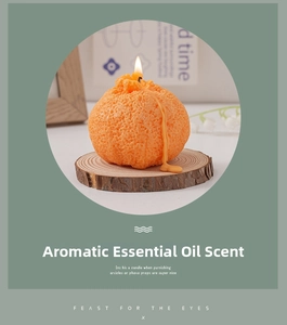 Detalle de vela aromática realista con forma de naranja y textura de piel natural con cera