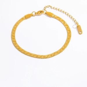 Detailed view of gold snake bone chain bracelet with lobster clasp and extension link