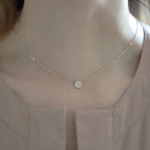 Elegant S925 silver 14k gold plated necklace with a paved round pendant on model