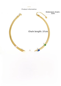 Close-up of gold snake chain necklace featuring five vibrant round-cut colorful gemstones
