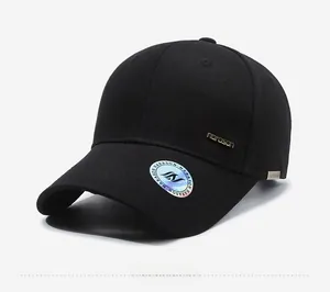 Detail of black baseball cap with golden metal logo and protective hologram on the visor