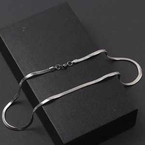 Minimalist 4mm silver stainless steel flat snake chain necklace on a black jewelry box