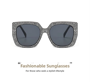 Close-up of luxury square oversized sunglasses with sparkling diamond encrusted frames