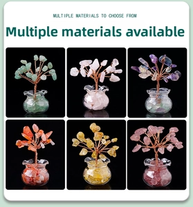 Close-up of handmade crystal trees in multiple colors with copper wire and glass bases