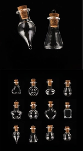 Macro view of assorted mini glass bottles with cork stoppers in various shapes
