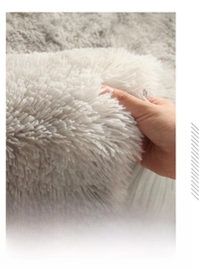 Close-up of thick white plush carpet texture showing high density and soft fibers