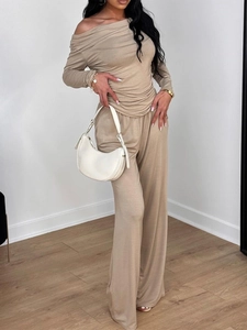 Elegant beige two-piece lounge set with off-shoulder long sleeve top and wide-leg trousers
