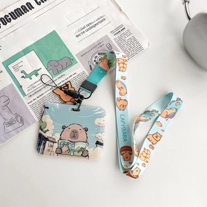 Cute Capybara ID card holder with matching lanyard on minimalist office desk setup