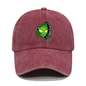 Close-up of the alien head embroidery on washed denim burgundy vintage baseball cap