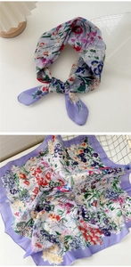 Detailed view of purple floral cotton linen scarf showing soft texture and petal pattern