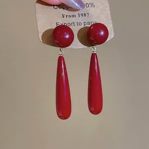 Elegant 18k gold plated long red teardrop pearl earrings for women in minimalist style
