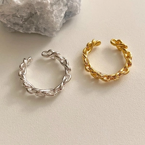 Detailed view of woven chain minimalist adjustable rings in silver and gold finishes