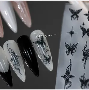Macro view of 5D gothic butterfly nail decals with black starburst and flowing lines