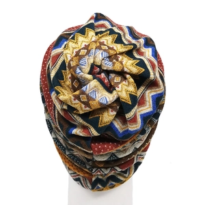 Close-up of bohemian knit beanie showing colorful ethnic geometric patterns and soft texture