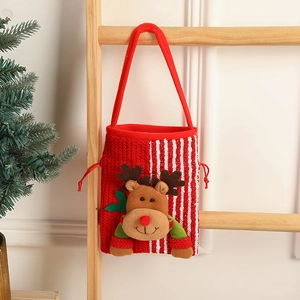 Knitted Christmas gift bag with reindeer doll hanging on a wooden ladder decoration