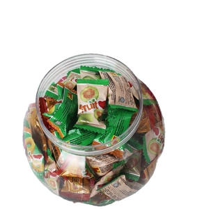 Christmas Santa snowman themed clear candy jar filled with guava fruit flavored hard candies