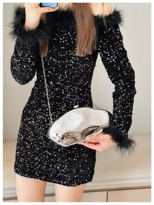 Irregular silver clutch bag with chain strap and reflective metallic acrylic finish