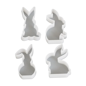 Set of four white Easter rabbit shaped silicone molds for DIY scented candles and gypsum crafts