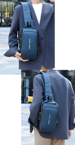 Detail view of anti-theft combination lock and USB charging port on navy nylon chest bag