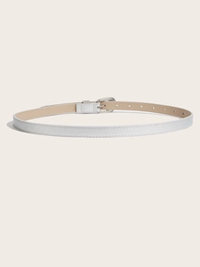 Close-up of white leather belt with silver metal buckle and fine stitching details
