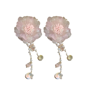 Pink lace flower earrings with crystal tassel and faux pearls on white background