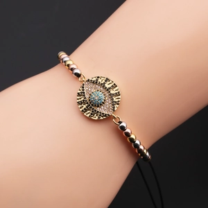 Detailed shot of evil eye bracelet featuring tricolor beads and adjustable black cord