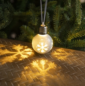 Detail of Christmas bulb pendant with warm LED light and snowflake projection effect
