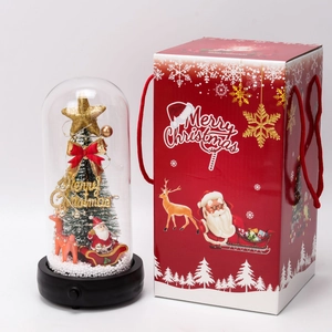 Christmas tree snow globe with reindeer inside a red festive gift box packaging