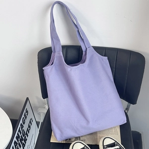 Macro detail of lavender canvas tote bag texture on a chair in a lifestyle indoor setting