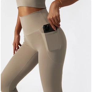 Detail shot of high-waisted yoga leggings showing the side pocket for smartphone storage