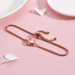 Detail view of a rose gold Virgo constellation bracelet with sparkling crystals