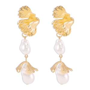 Detailed view of gold leaf design long earrings with white baroque irregular pearls