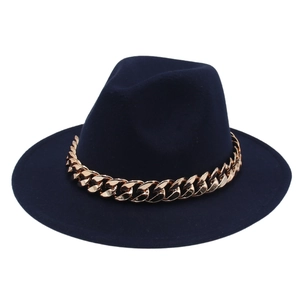 Detailed close-up of navy blue wool fedora hat with a bold gold chunky metal chain