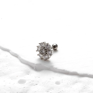 Macro shot of silver flower earring with clear cubic zirconia and screw-back ball