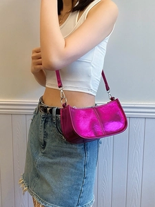 Metallic fuchsia punk shoulder bag with glossy mirror finish and adjustable strap