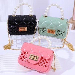 Mini jelly bags in black green and pink with pearl handles and metal chains