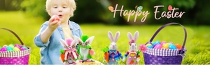 Detail of plush Easter gnomes with rabbit ears on a sunny spring garden lawn backdrop