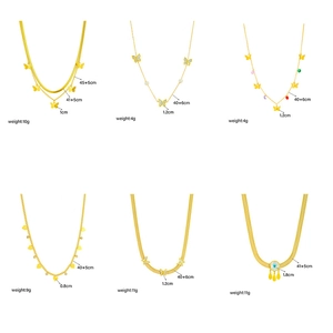 Selection of gold necklaces with butterfly, heart, and evil eye charms on various chains