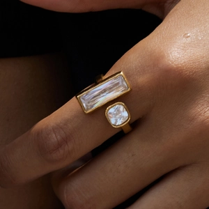 Detail of 18K gold stainless steel open ring with square and round zircon gems on finger