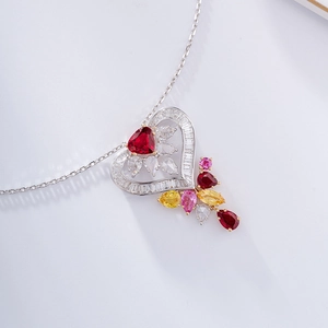 Close-up of heart-shaped luxury necklace with red ruby and multi-color zircon stones