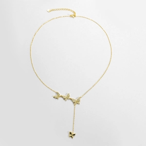 Close-up of gold butterfly necklace featuring shimmering pavé set cubic zirconia charms