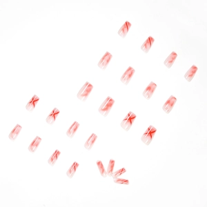 Long coffin press-on nails with red smoke marble and X-shaped art on milky white base