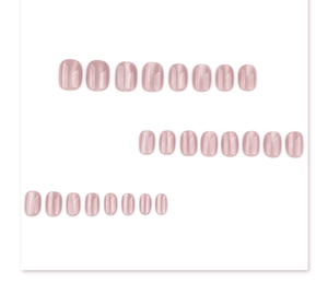 Macro shot of 24pcs nude cat-eye press-on nails in short oval shape on white background