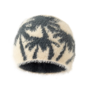 Plush off-white and charcoal knit beanie hat with soft faux fur texture and coconut tree pattern