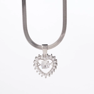 Silver heart necklace with dancing zircon pendant and flat snake chain on white background