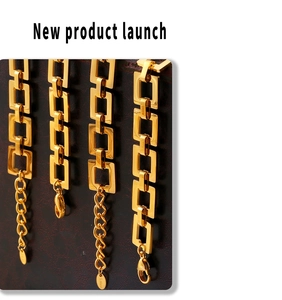 Close-up of golden stainless steel geometric hollow square plate bracelets with lobster clasp