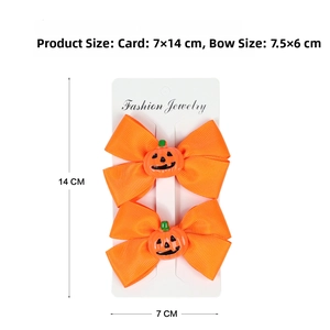 Detail of Halloween pumpkin hair bows on 7x14cm display card with orange ribbon texture