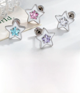 Detail of star-shaped stud earrings set with colored zircon stones and steel base